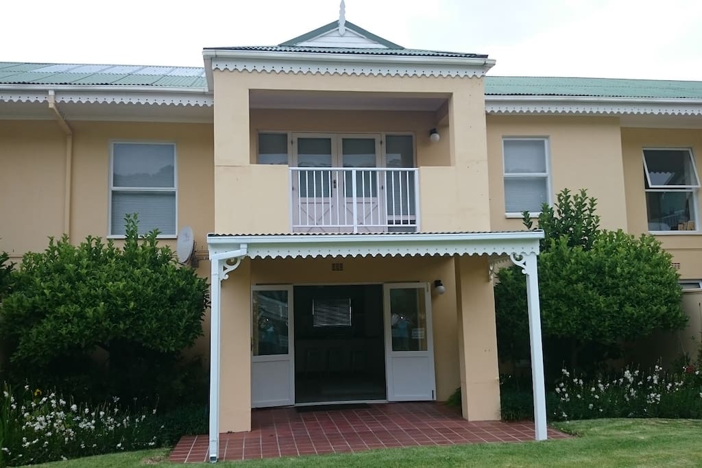 This ground floor unit offers a spacious patio opening into the garden