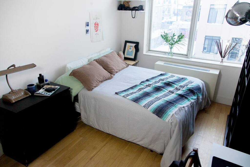 The bedroom, queens size bed, loads of light