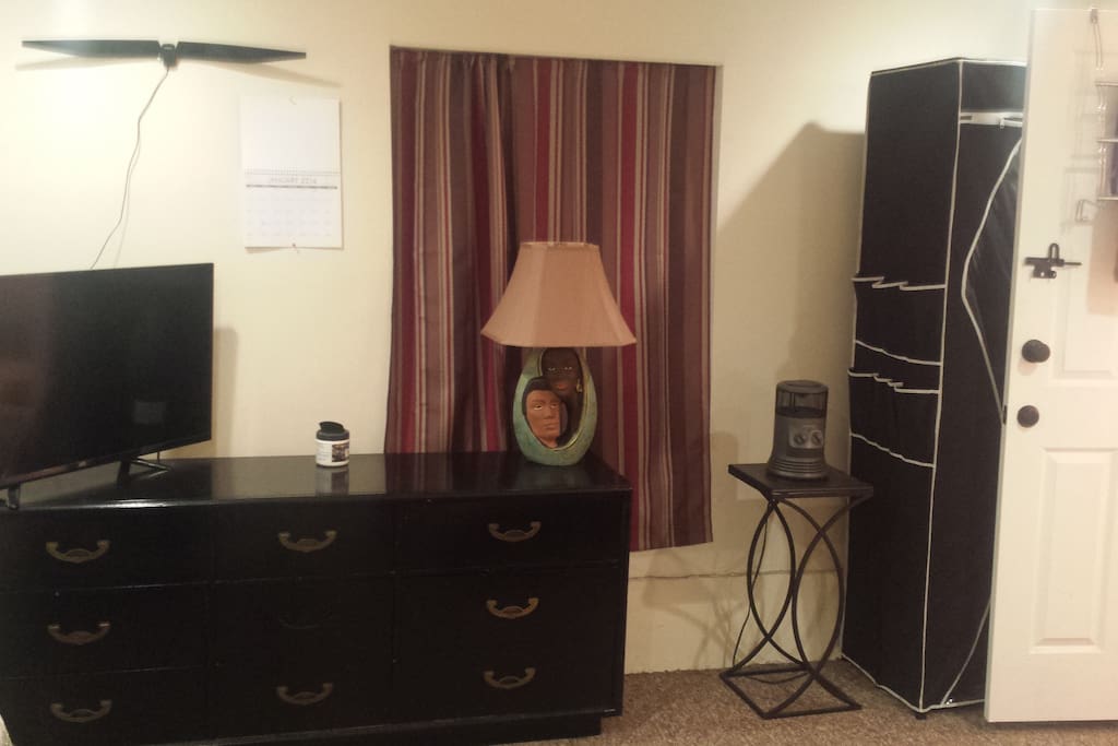 47' Color TV, dresser. remote lamp, plug in heater and closet.