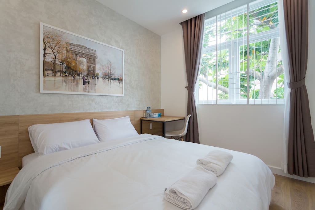 Your room with natural light, queen size bed, working desk, wardrobe, private fridge, private bathroom , clean beddings and towels