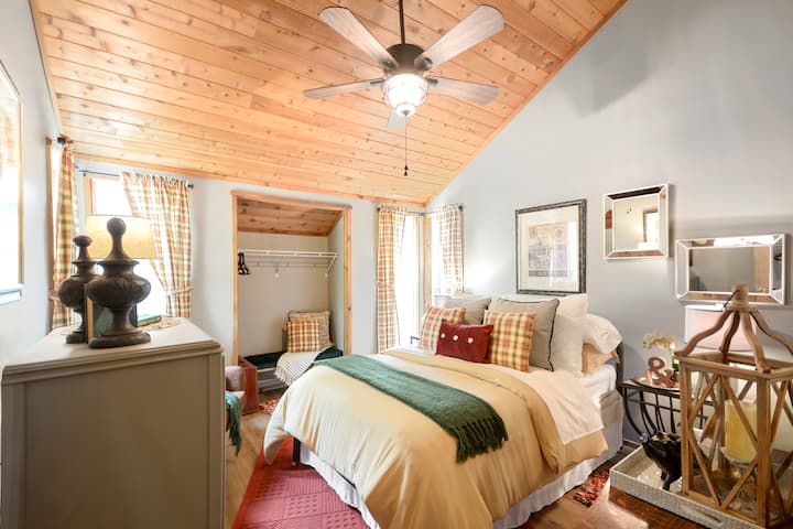 Luxury bedding, vintage furnishings and of course, those vaulted wood ceilings