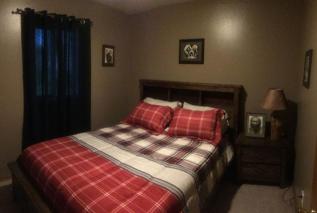 The Eskimo Room. Decorated with fantastic black & white Eskimo photos from the early 1900's. Handmade log lamp, brand new bedding and mattress. Very comfortable.