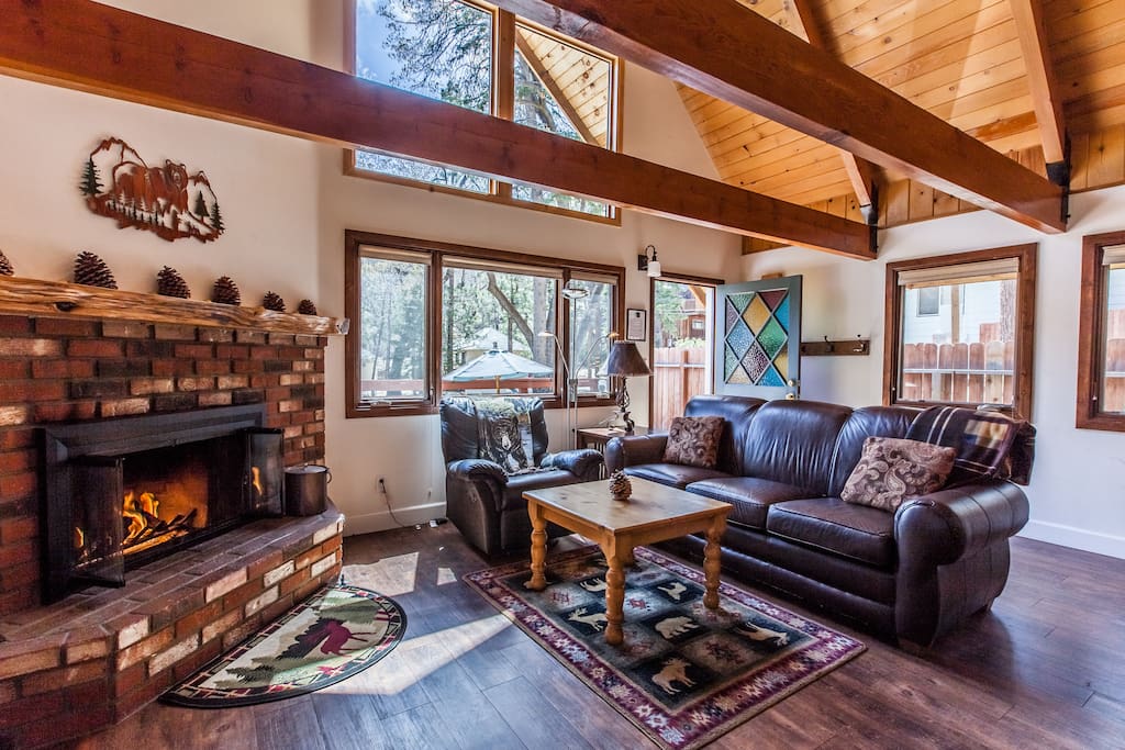 Living room with classic wood beams, hardwood floor, vaulted ceiling and soaring windows. HDTV Roku for access to Netflix and dozens of channels. DVD player and high speed WiFi.