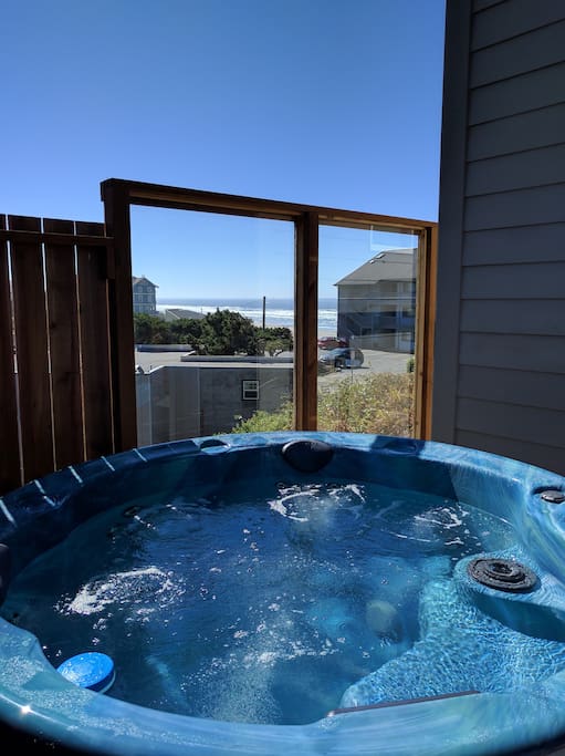 Relax in the 6 person hot tub while watching the whales