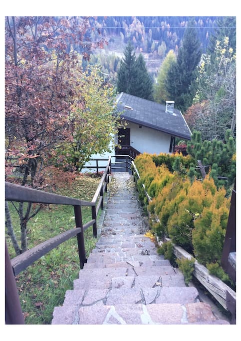 Stairs to the front door of the villa. Reserved parking for one car