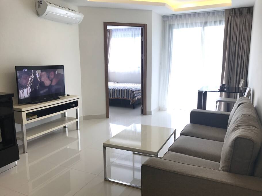 Living room with kitchen and balcony