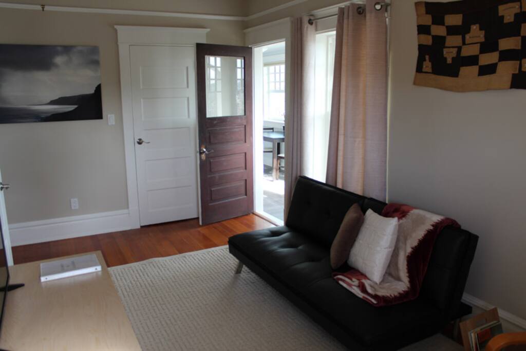 The living room leads out to the sunroom.