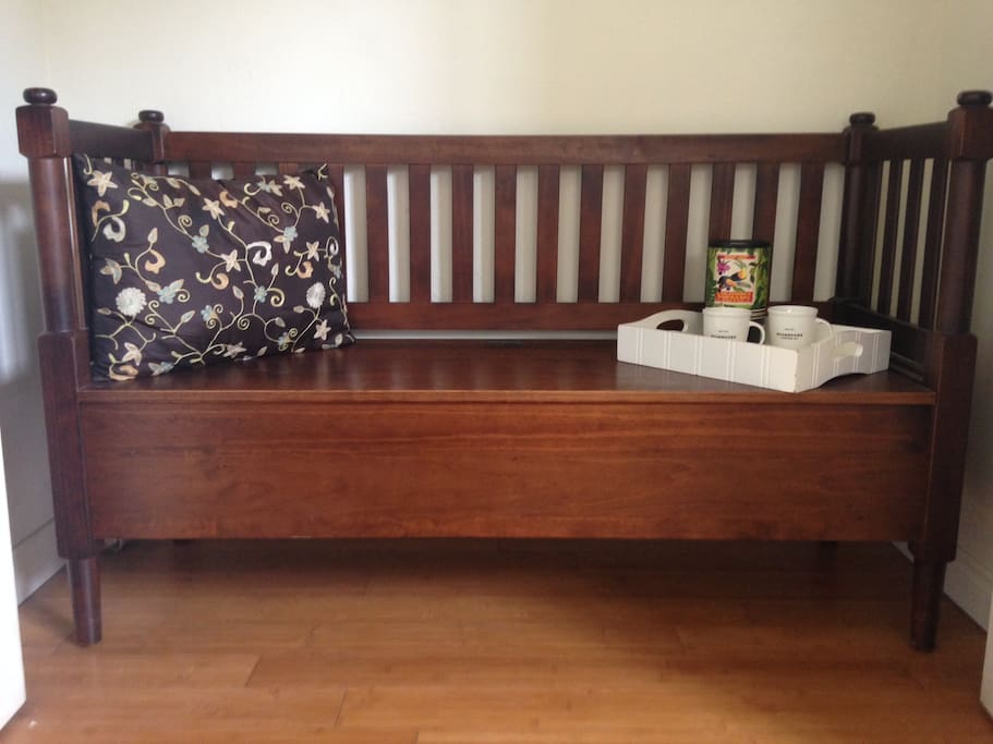 Indoor bench area with extra storage. Hair dryer, iron etc. are stored in this bench.