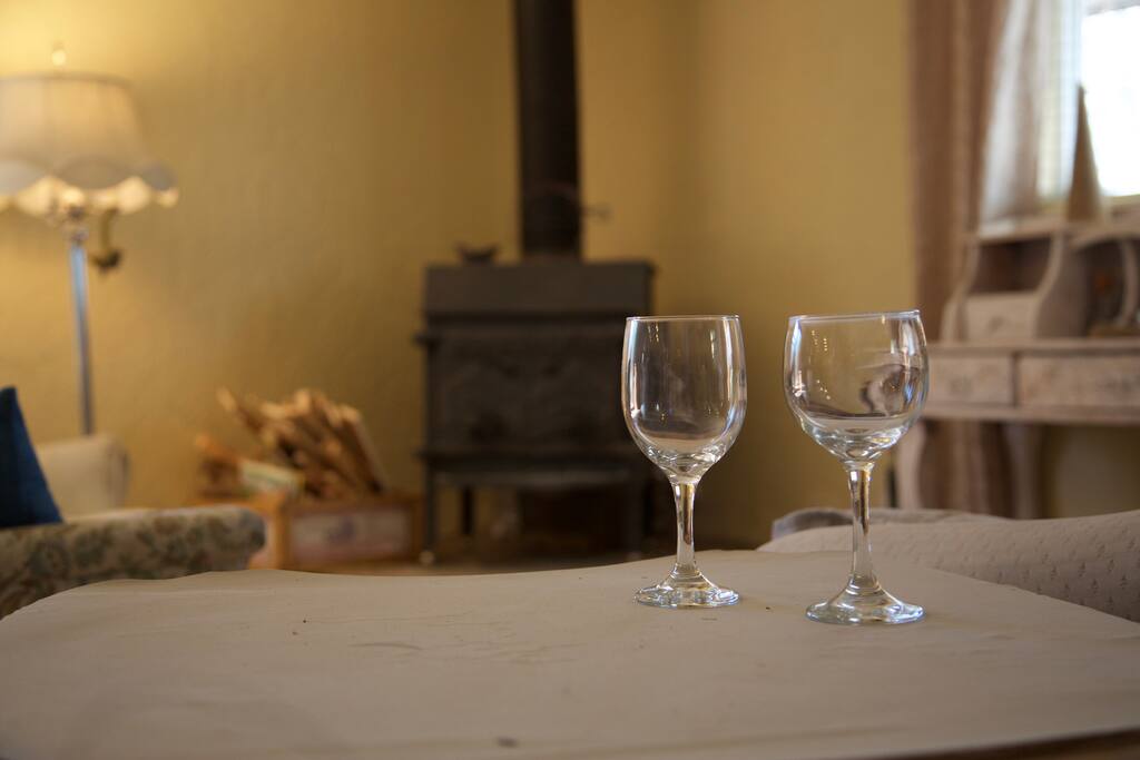 ATELIER (\a-tell-yā\)
(shared common): a room where an artist works
Wood burning stove and writing desk