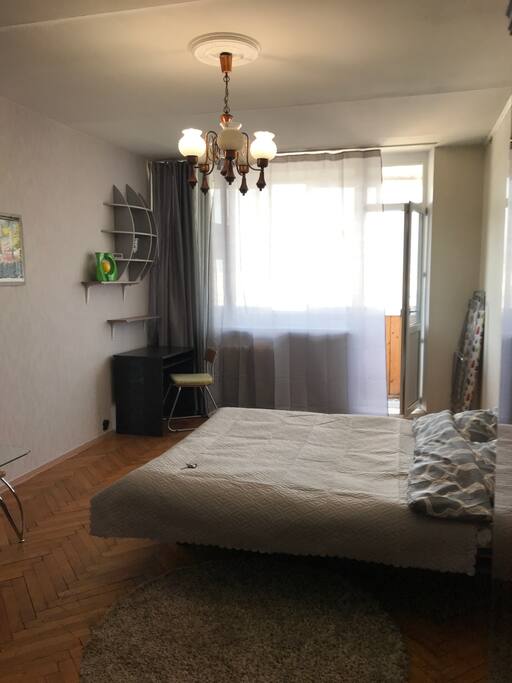 Main room view with transformed sofa to bed