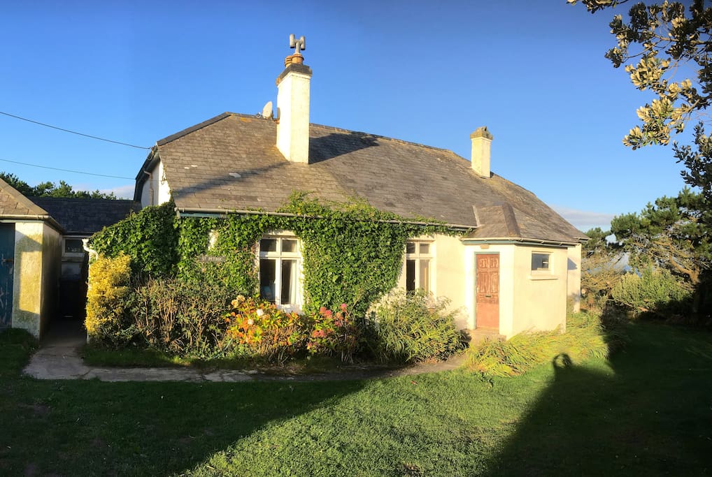 St Petroc, as one drives onto the property. The entrance is through the kitchen left of the left-hand window.