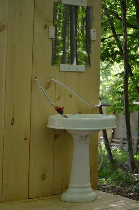 Outdoor sink. There is another sink inside the camper.