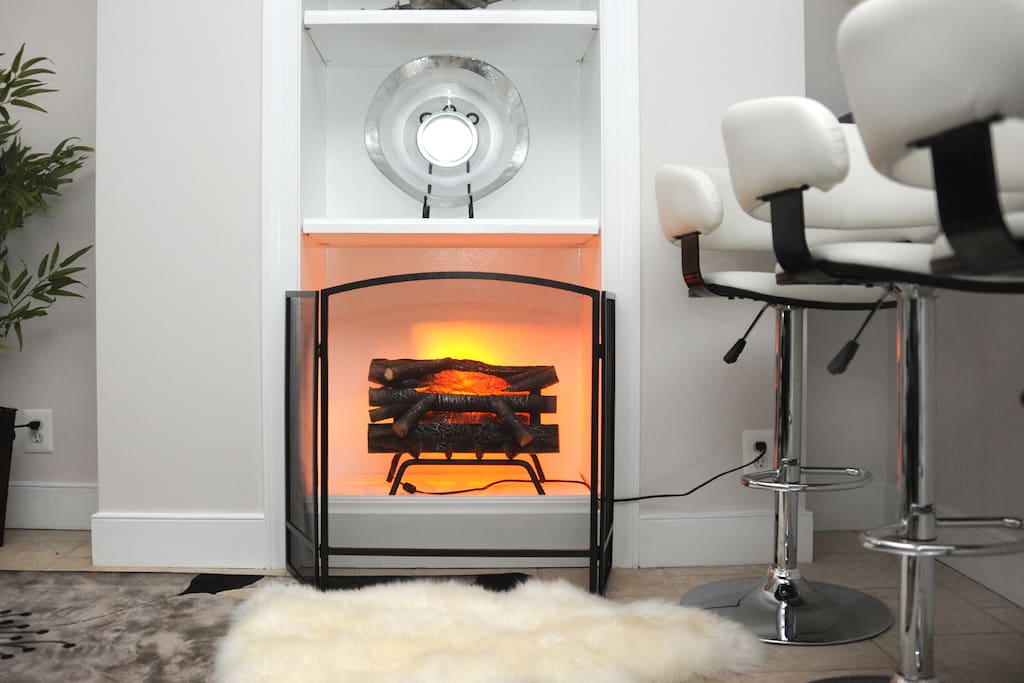 Electric fire place - sheepskin rug