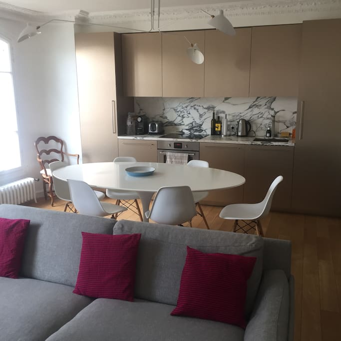Eating and cooking area. Open to living area. With nespresso, electric kettle, stove, oven, dishwasher, freezer, and fridge.