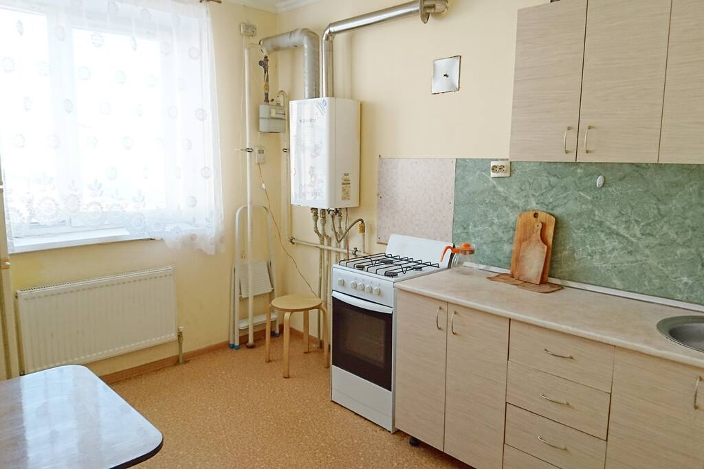 Kitchen with an oven and a full set of tableware