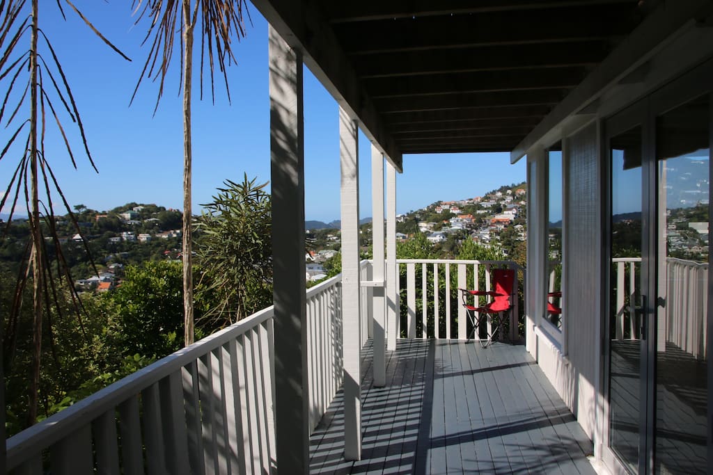 Private deck outside bedroom/lounge. Native bush and harbour views.