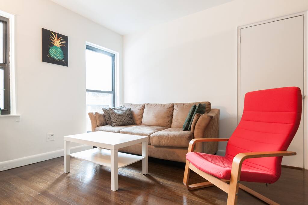The cool, trendy living room. A lot of natural light! And a large TV