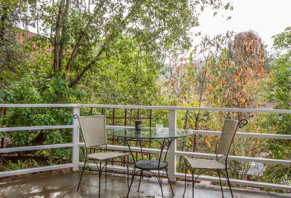 3rd balcony (Yes, there are 3!) view in the treetops of Bel-Air, off the main road enough to lose traffic noise but close enough to be convenient.