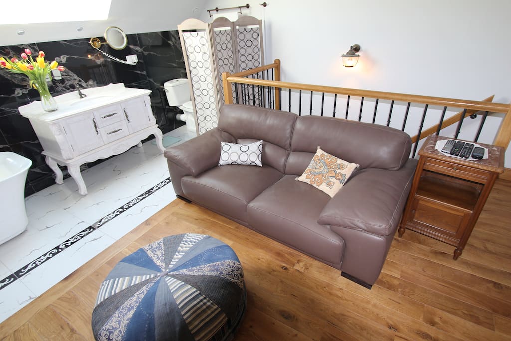 A leather lounge suite to relax on with a book or the tv on.