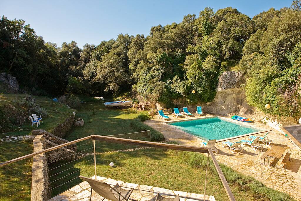 View from the terrace towards the pool and woods