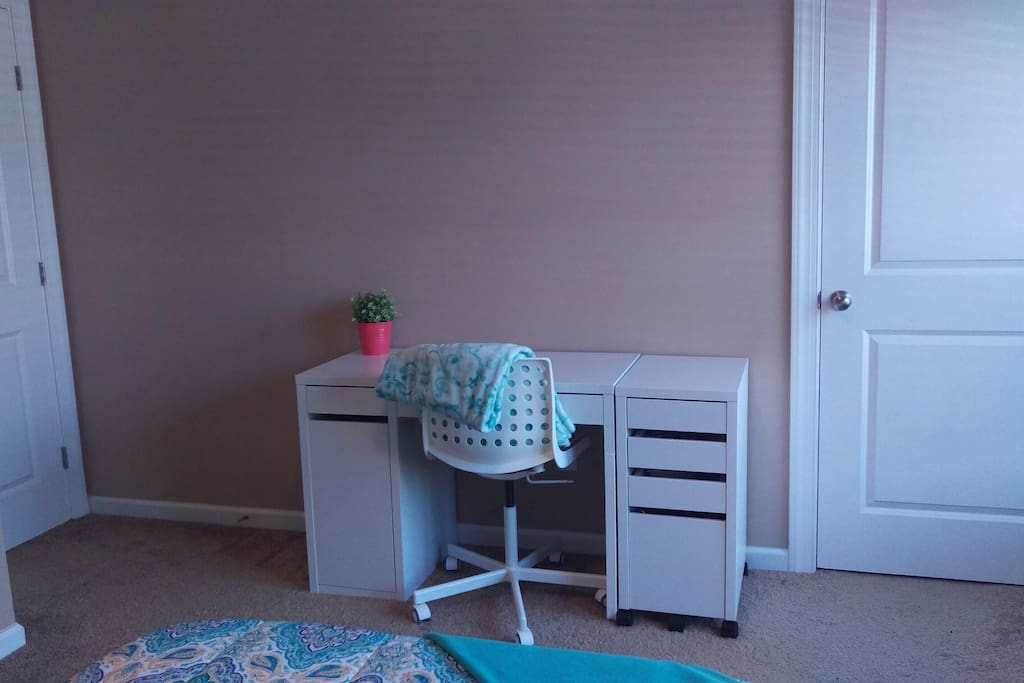 Desk with ample workspace in bedroom 1