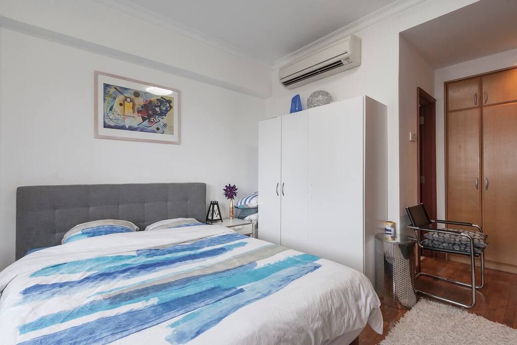 Master Bedroom by day, with large queen bed
