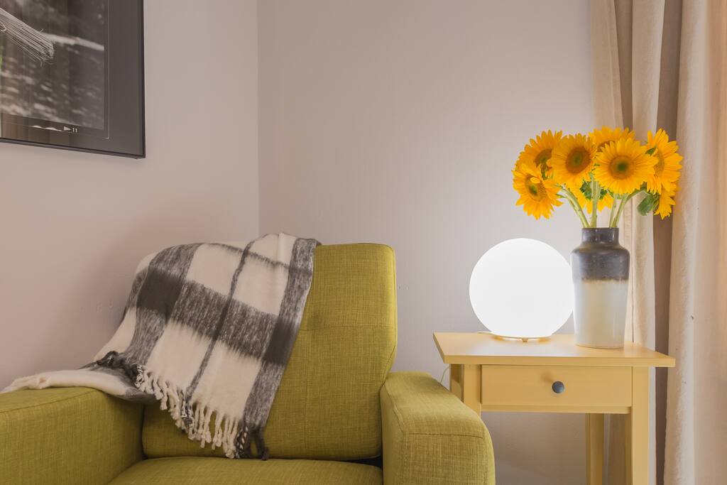 Cozy sitting corner in queen bedroom.