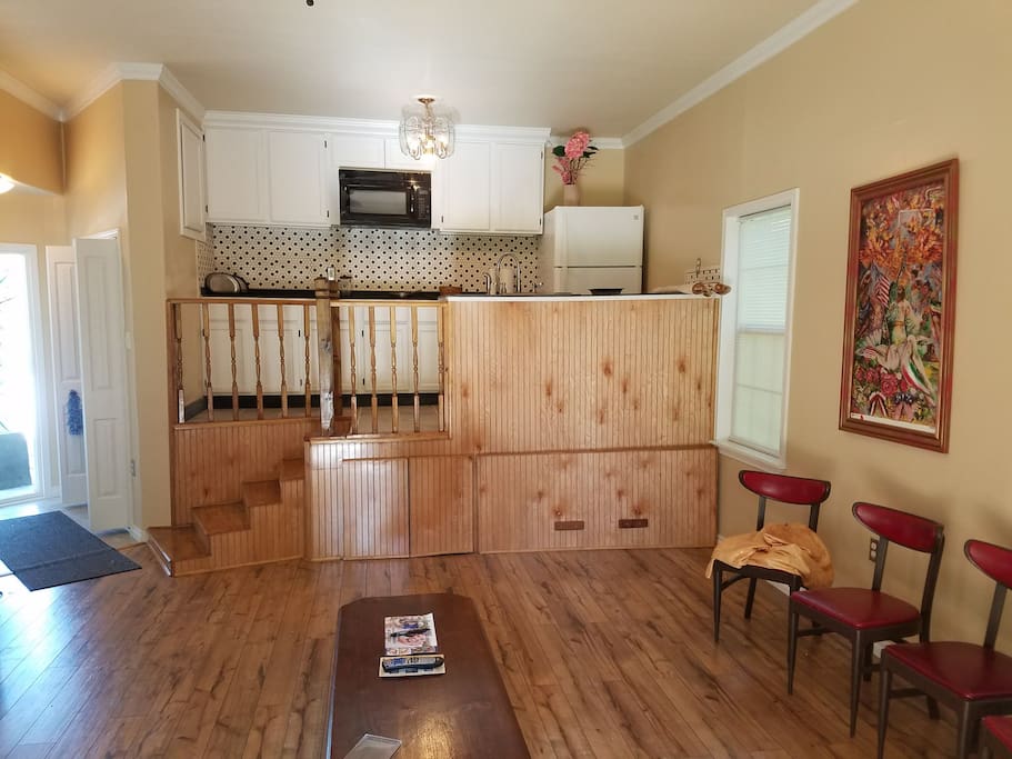 The stairs lead to the kitchen.