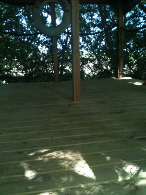 ~9x14 size of deck
The space can accommodate 2 queen sized air beds or a small tent.