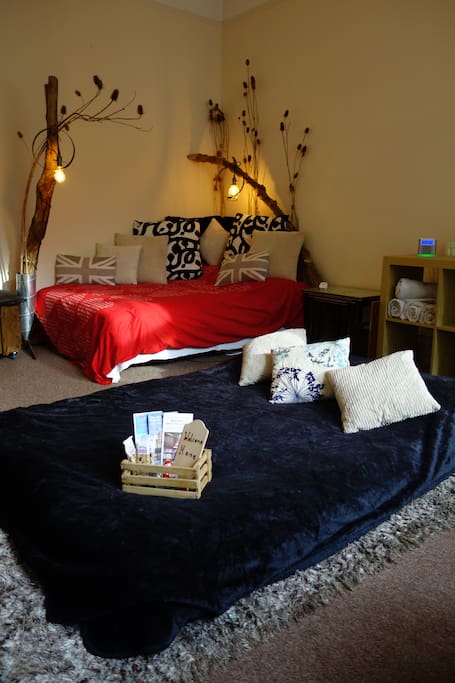 Two double beds with limitless pillows and blankets for 4 people. 2 additional single beds are available to comfortably set up on the adjacent floor space.