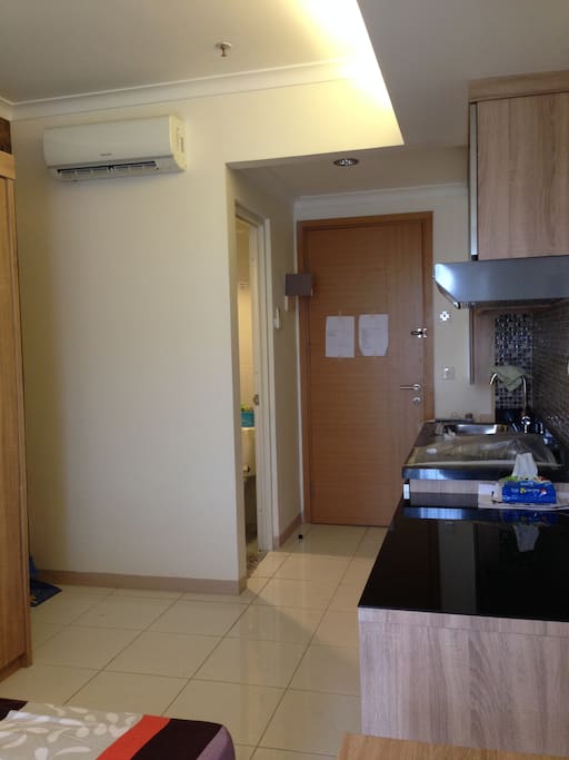 view from window, there are pantry with sink, stove and dining table