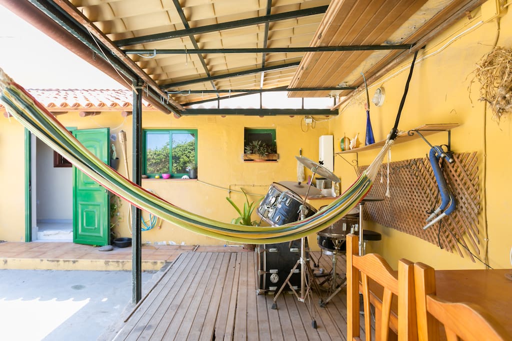 Covered area in the outside patio with an hammock