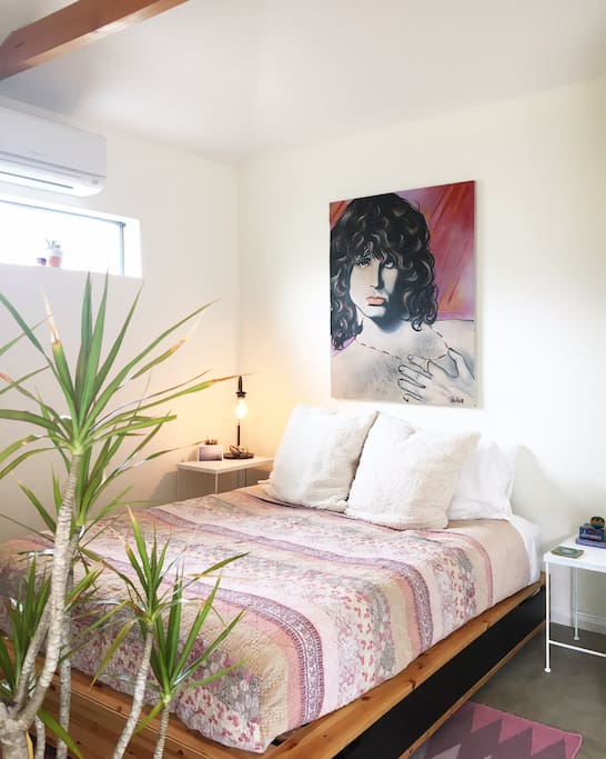 The bungalow is filled with some of our favorite books, treasures from around Venice, and this Jim Morrison painting that my husband's friends commissioned for him when he graduated college.