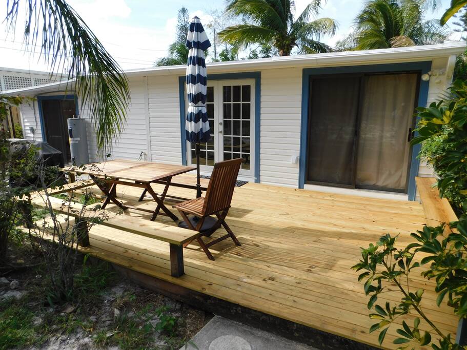 Back deck with a gas grill and plenty of seating