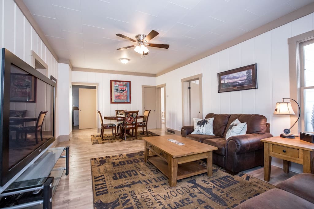 Cozy and inviting living room with leather sofa and large flatscreen TV