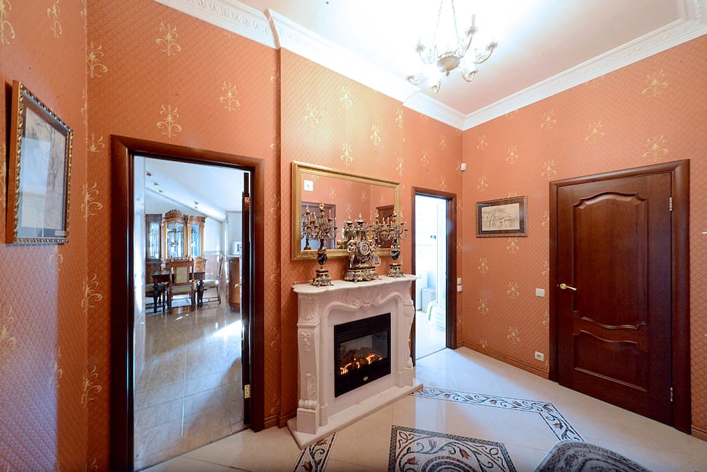 Entrance Hall. Carved marble fireplace (electric, imitation fire). Left to right: double bed, living room, kitchen, bathroom.