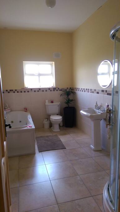 Private bathroom, including power shower and jacuzzi bath.