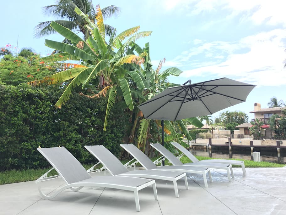 Chaise Lounges Poolside w/ Umbrella