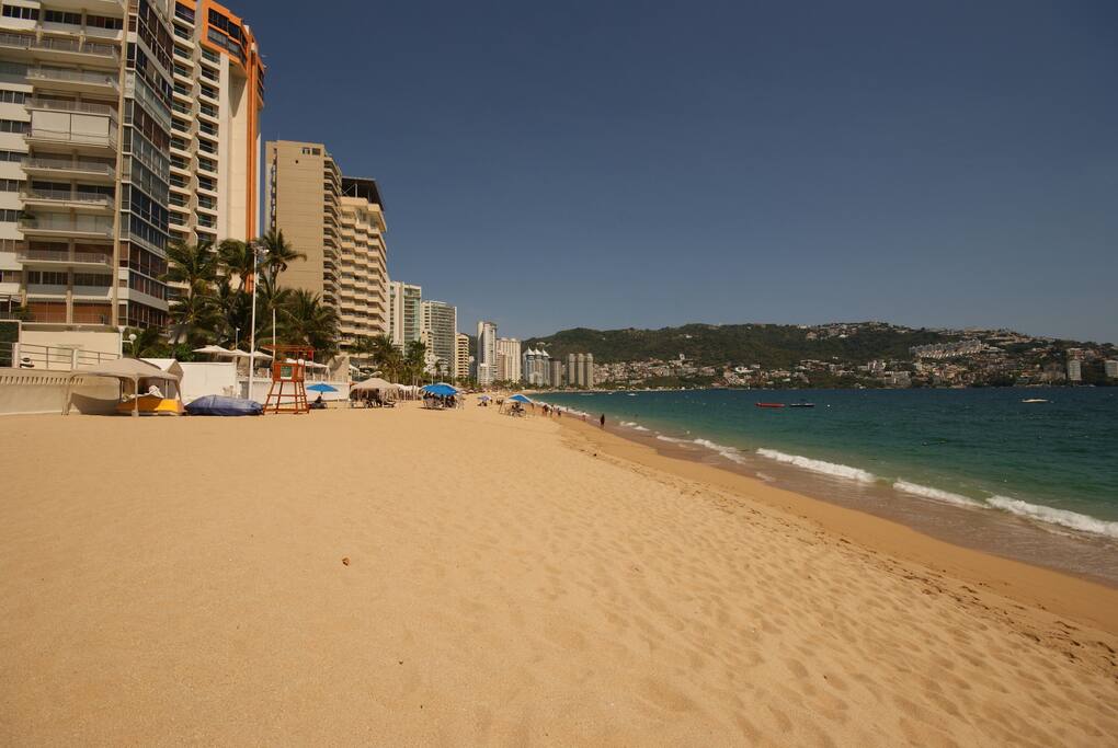 Beach in front of the building.
