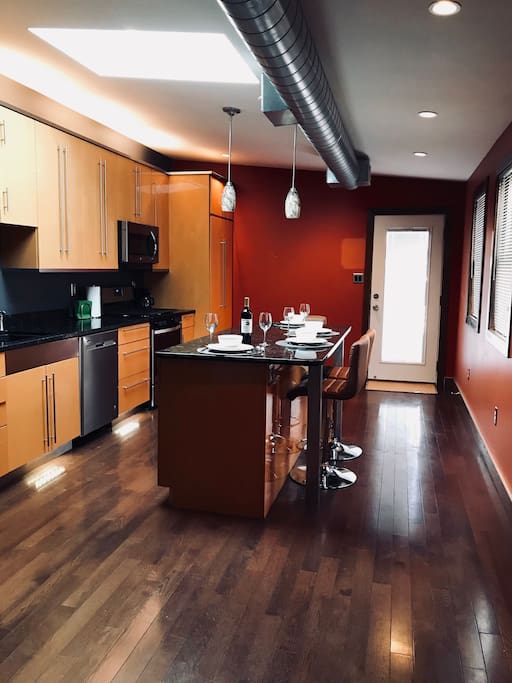 This beautiful kitchen features a lovely connecting balcony.