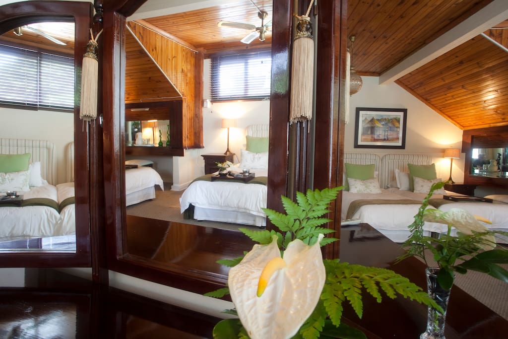 Room 4 - Family Room, four single beds, shower, bath and lots of space.