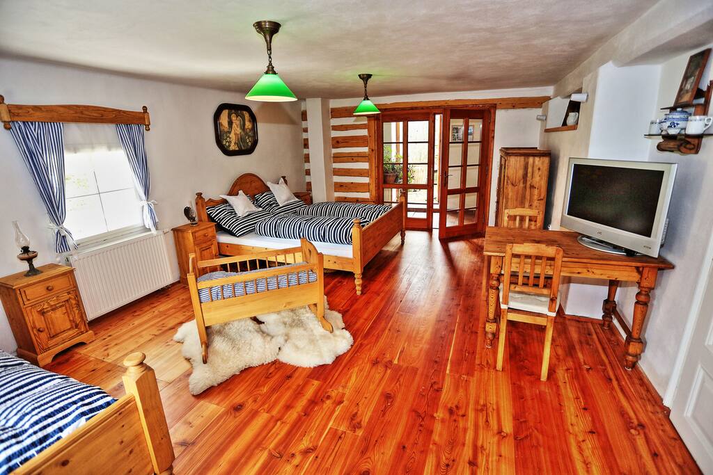 Timbered bedroom provides a splendid view to the mill wheel and the private patio.