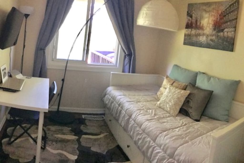 The room offers a full closet, twin size bed that opens up to a king, and has 3 large drawers built under it, a smart tv, and a small desk. There is also a California Closet to store clothes and travel items.