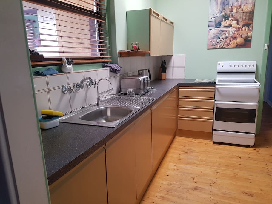 Kitchen. Full family sized Fridge/Freezer, 4 Burner Hallogen stove top with fan forced oven, Microwave. Fully Equipped