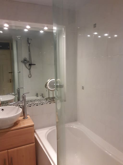 Bright bathroom with separate toilet next door