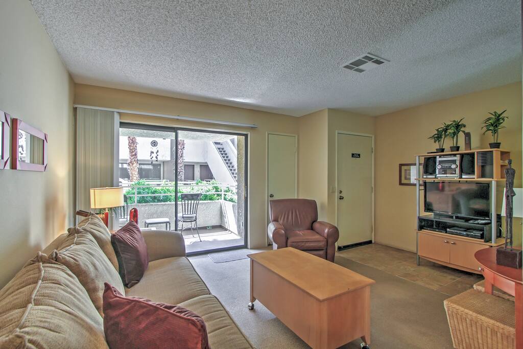 Lounge around in the cozy living room, where the light from the windows of the front patio sliding doors illuminates the space.