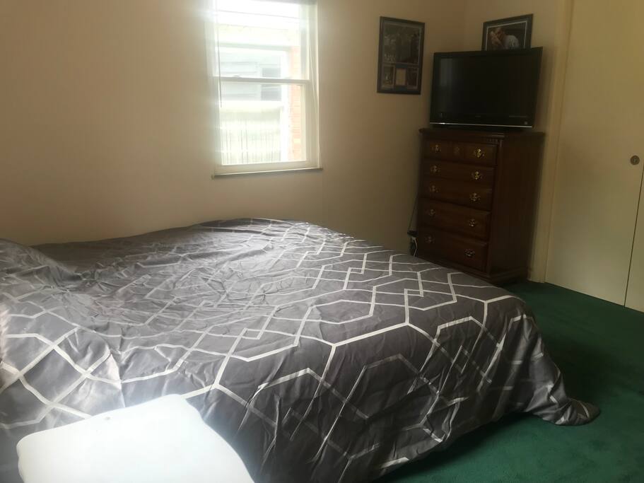 King bedroom with tv