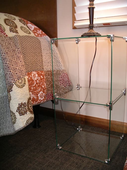 Next to each twin size bed is a cubby space.