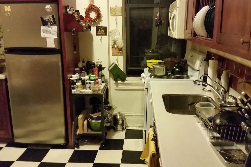 Kitchen with dishwasher, full stove and refrigerator