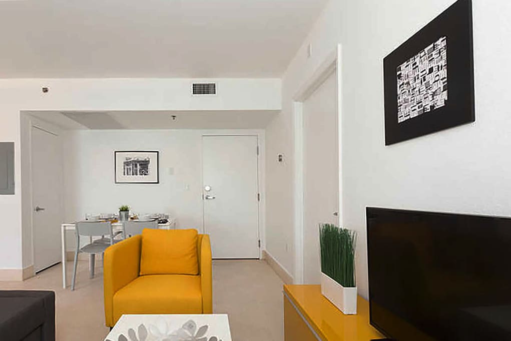 Stylish living area with TV and a sofa bed